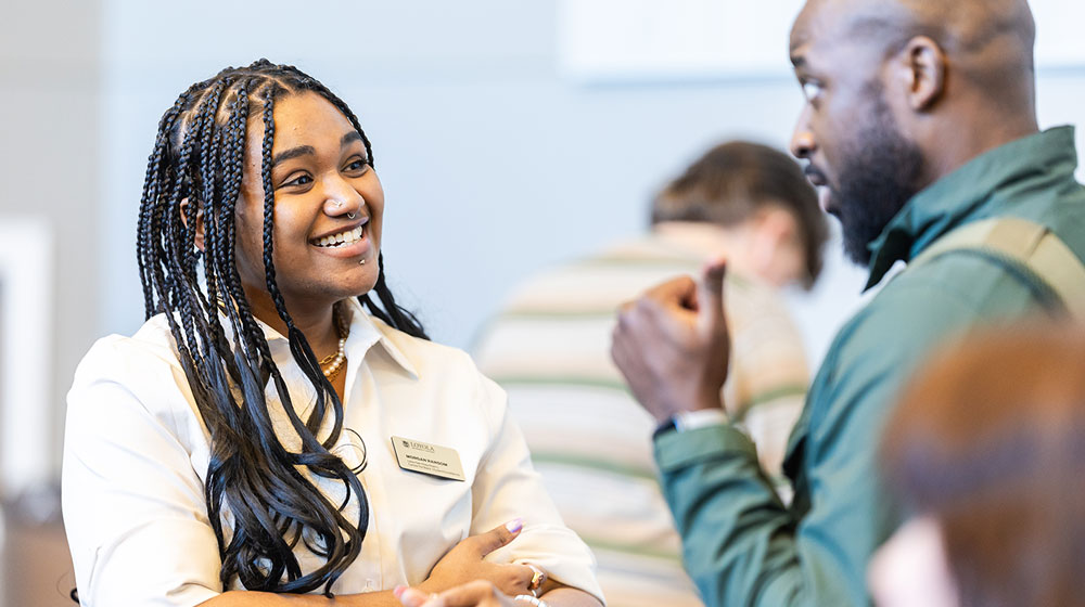 Staff members converse at a Diversity, Equity & Inclusion event.