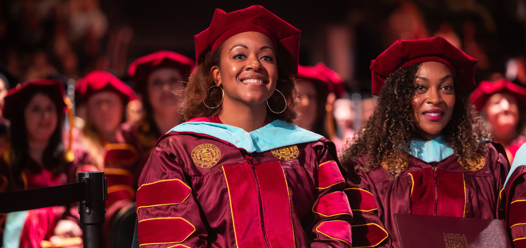 Loyola University Chicago graduates celebrate during commencement