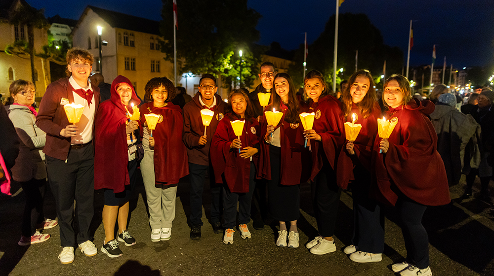 Marty McNaughton, far left, poses with students and faculty in Lourdes, France, in May 2024. McNaughton, the American Nurses Association-Illinois’ 2024 Student Nurse of the Year, took part in Loyola Nursing's annual service immersion trip to Lourdes.