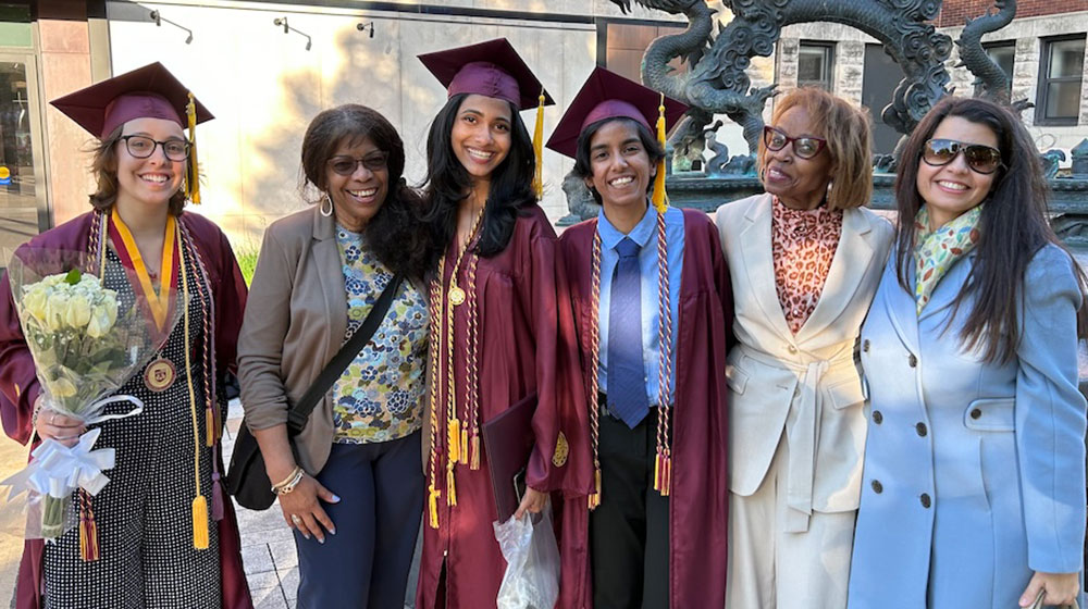 A group of 2024 graduates and family members.